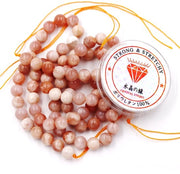 Kralen con corda per l'assemblaggio di accessori DIY Pietre per collane in vendita a lotti di 128 pezzi e 1 rotolo di corda 6 mm Zonnestone A 6 mm