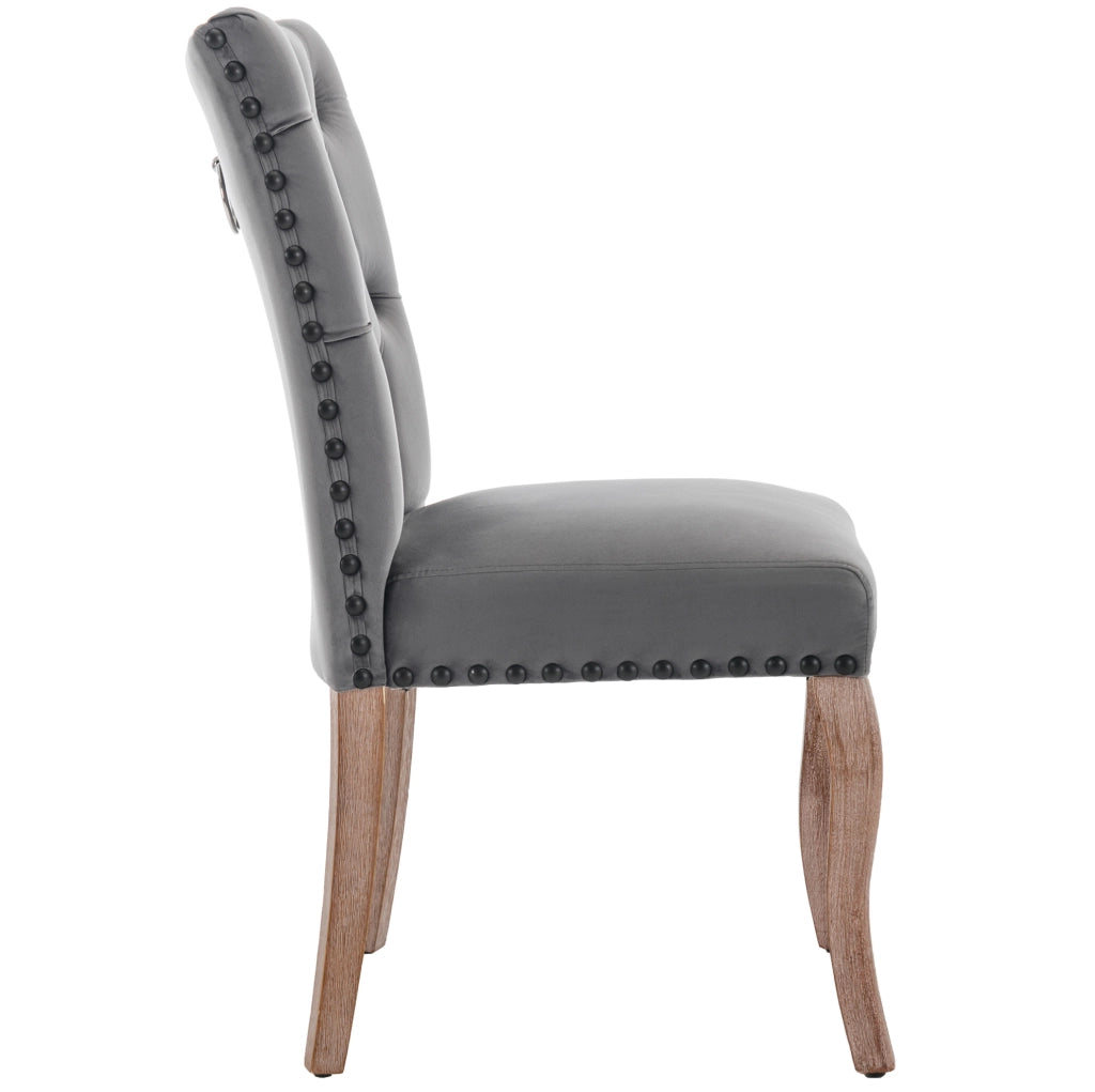 Sedia da pranzo in velluto grigio con gambe in legno e borchie decorative