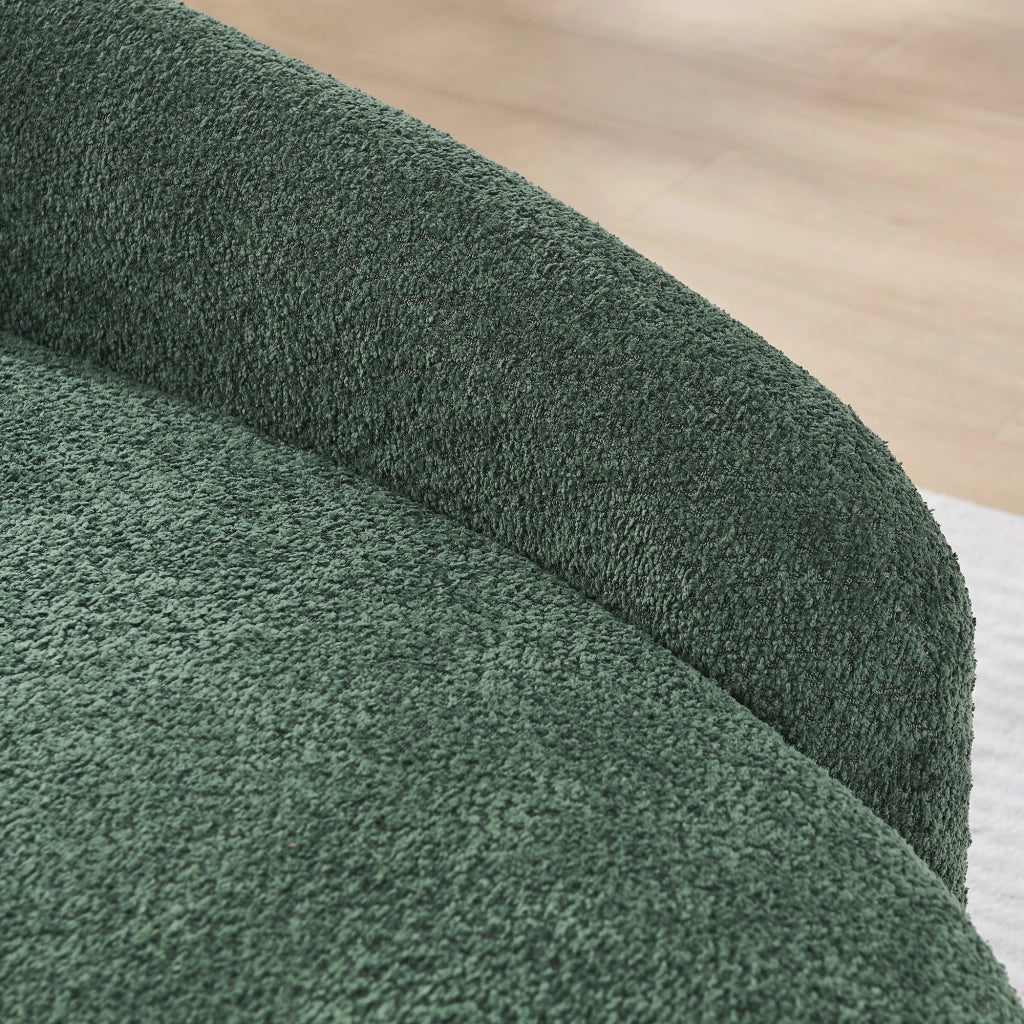 Divano compatto in Teddy verde con design arrotondato, cuscino di supporto e imbottitura elastica