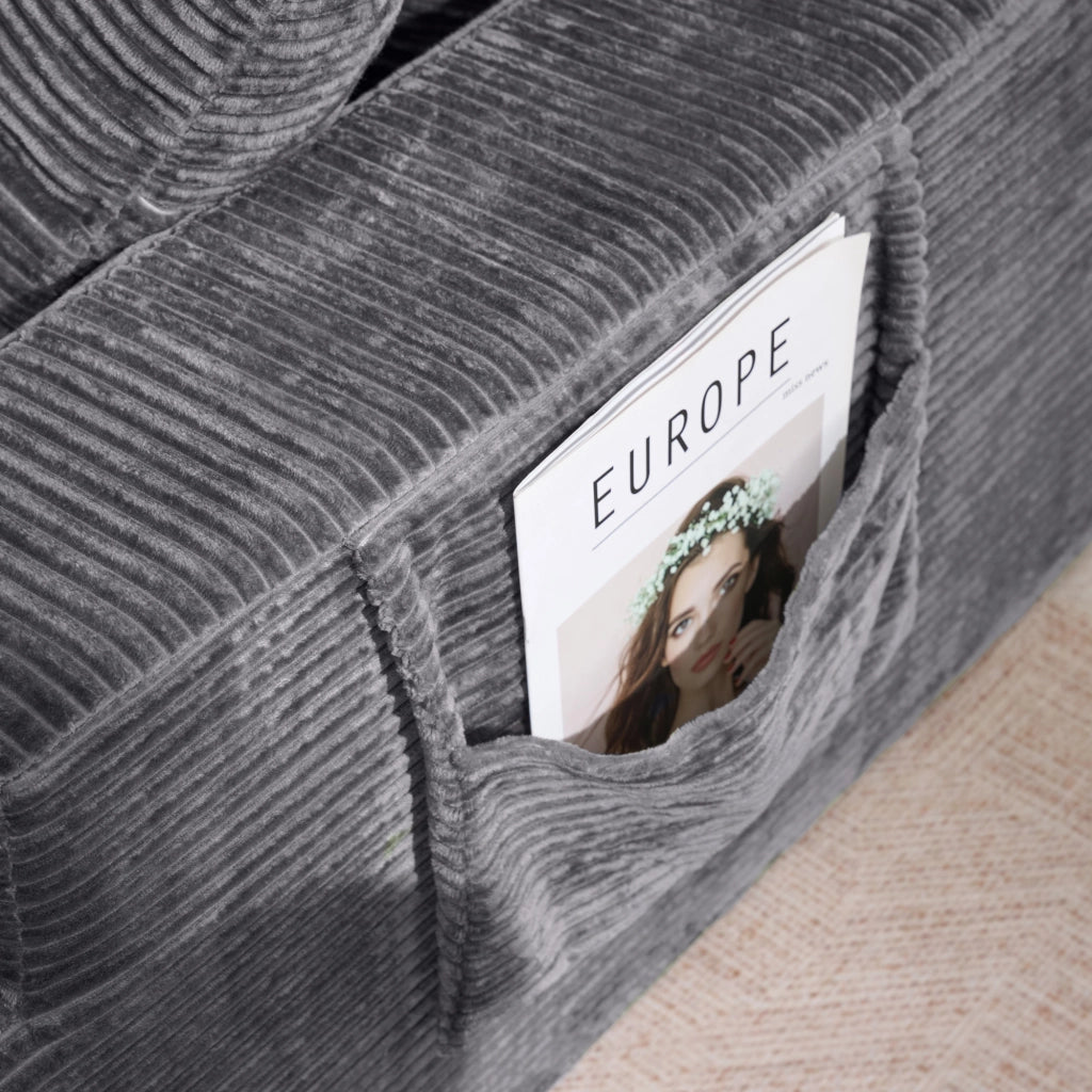 Divano dritto con tasche laterali e cuscini in velluto a coste grigio scuro