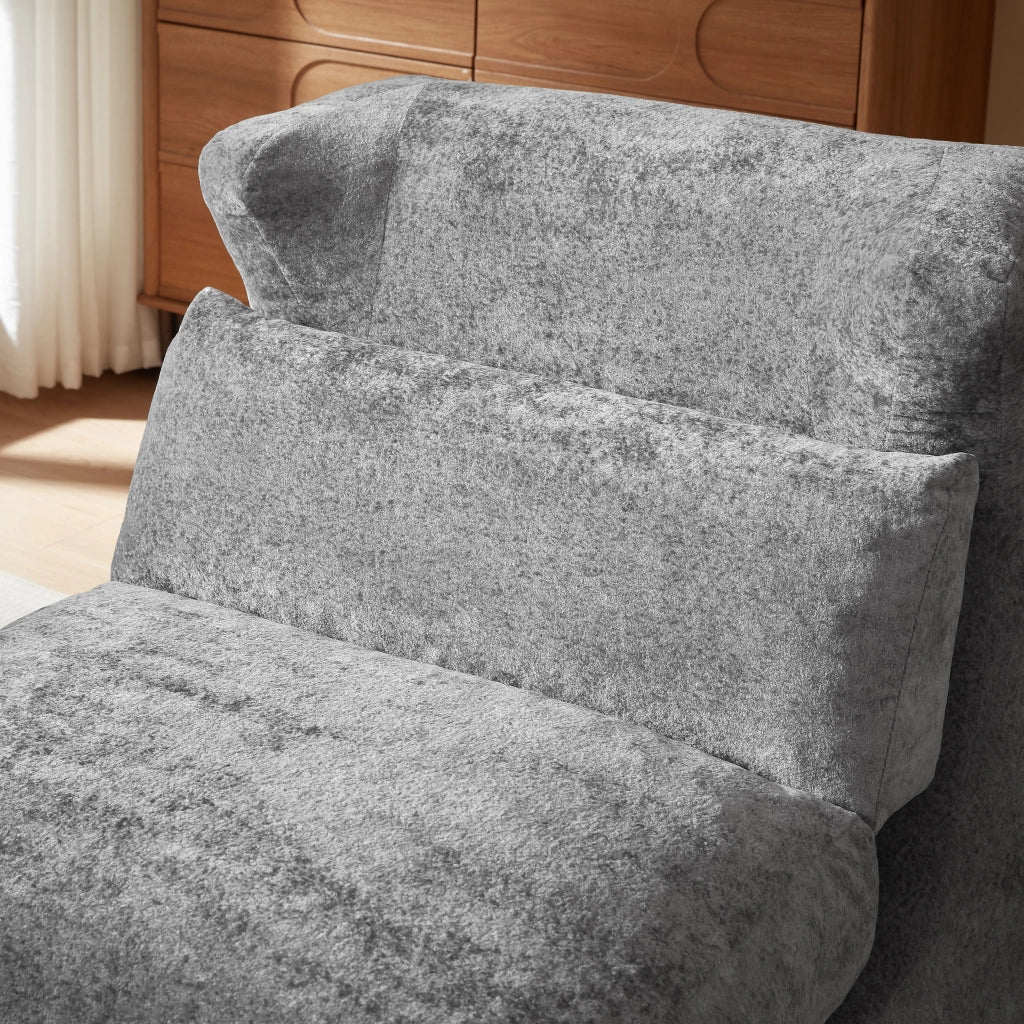 Poltrona componibile senza struttura in foam grigio, design moderno e uso versatile per soggiorno e camera da letto