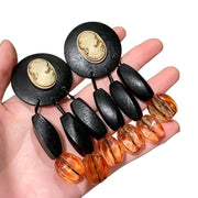 Orecchini in vetro arancione di alta gamma, ispirati allo stile vintage italiano, eleganti e raffinati.