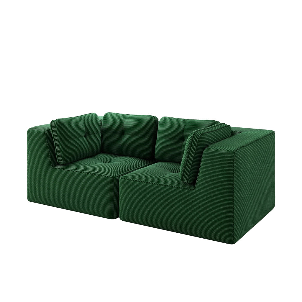 Divano angolare modulare senza struttura, rivestito in corduroy verde, con seduta profonda e comfort soffice