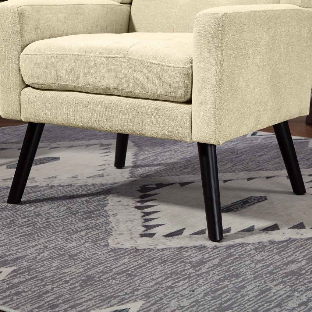 Poltrona imbottita con trapuntatura e seduta ergonomica salvaspazio per soggiorno camera o studio in lino beige