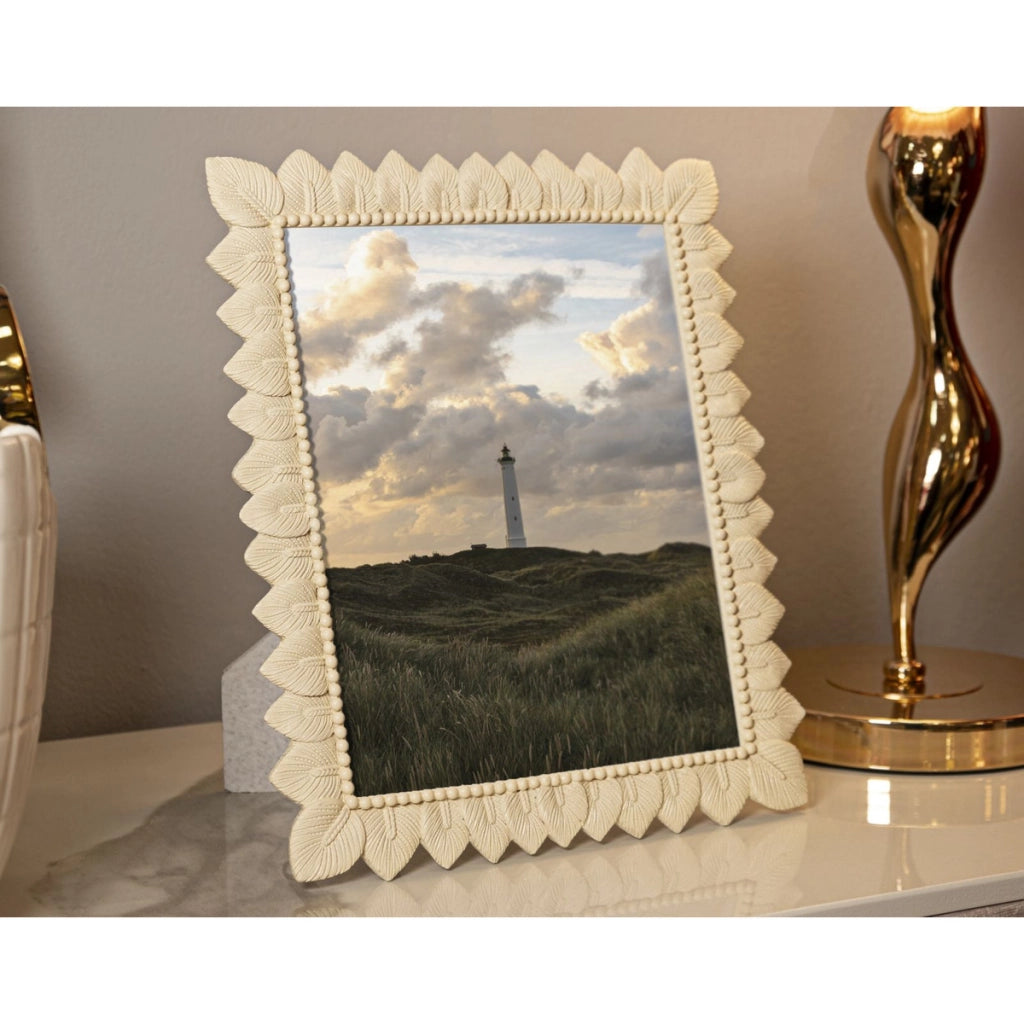 Cornice portafoto Light Leaf in resina crema con foglie 20x25