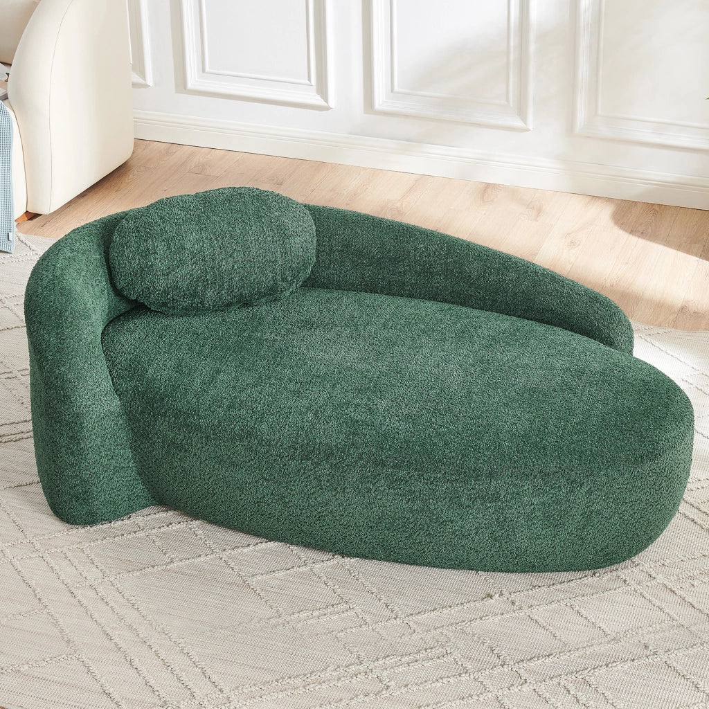 Divano compatto in Teddy verde con design arrotondato, cuscino di supporto e imbottitura elastica