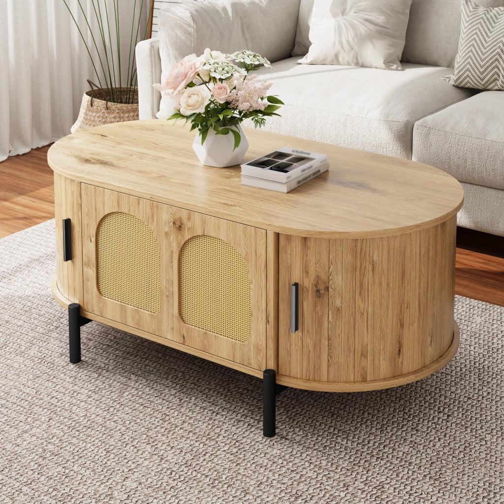 Tavolino da caffè ovale in MDF effetto legno naturale con ante in rattan e gambe in metallo nero, con vano contenitore