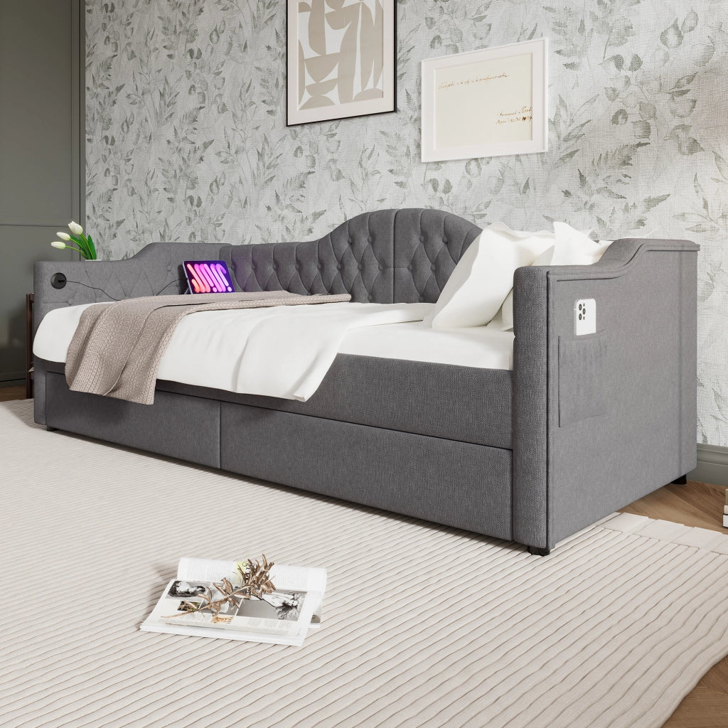 Letto a giorno imbottito con testiera trapuntata; 2 cassetti; porta USB/Tipo-C e tasche laterali; lino grigio; 90x200 cm; senza materasso