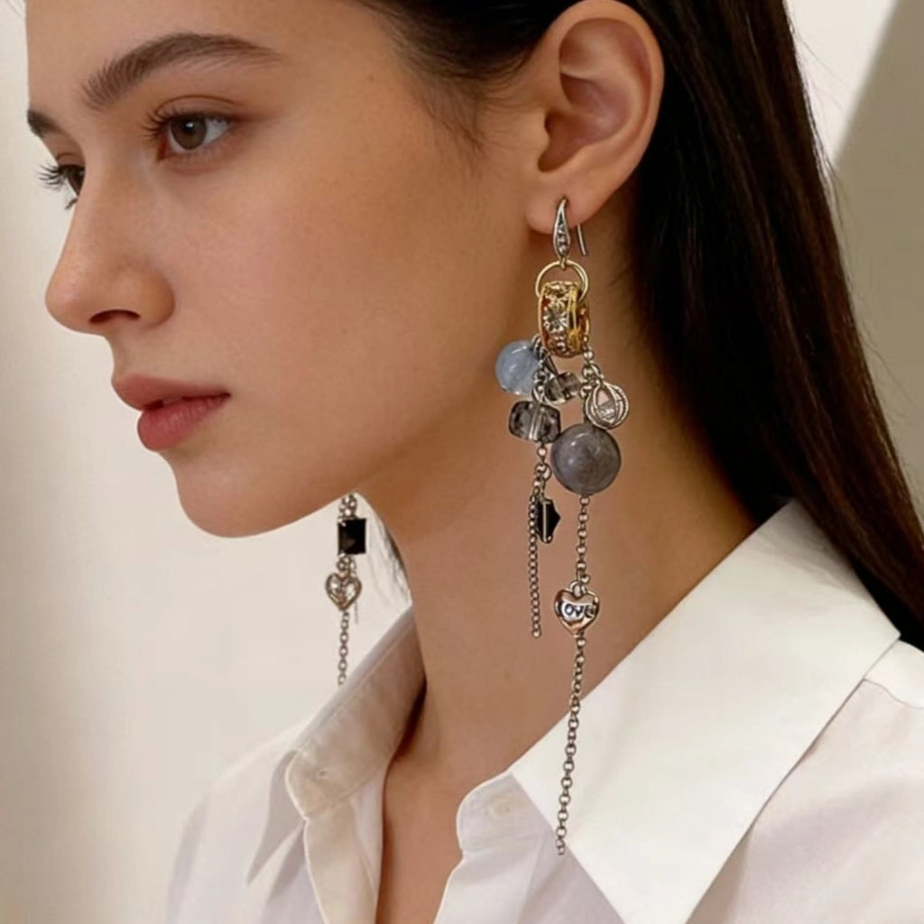 Orecchini vintage con sfera di cristallo blu e nappa
