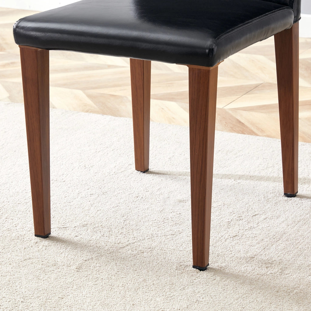 Set 4 sedie da pranzo moderne in PU nero con gambe in metallo effetto noce