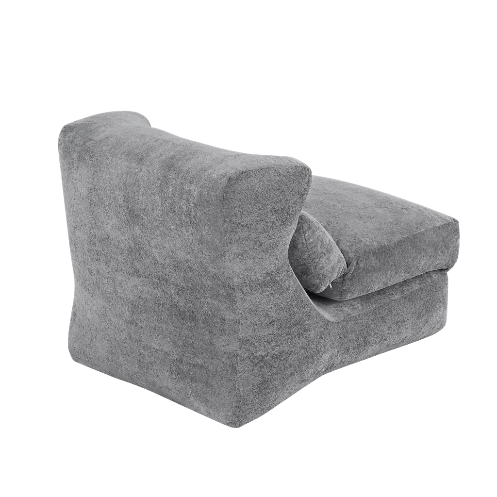 Poltrona componibile senza struttura in foam grigio, design moderno e uso versatile per soggiorno e camera da letto