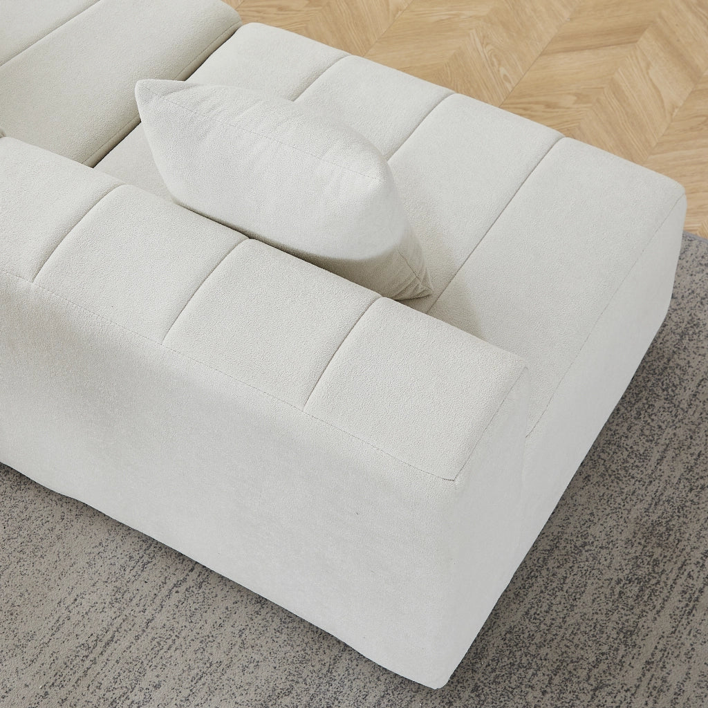 Sofà modulare curvo in chenille beige, composizione semicircolare da 6 moduli con 2 cuscini