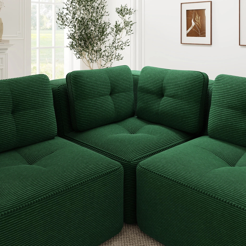 Divano angolare modulare senza struttura, rivestito in corduroy verde, con seduta profonda e comfort soffice