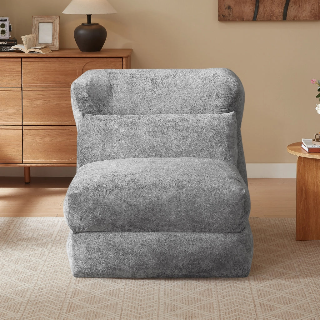 Poltrona componibile senza struttura in foam grigio, design moderno e uso versatile per soggiorno e camera da letto