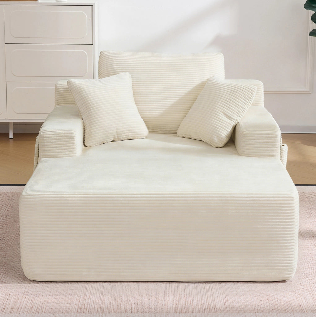 Divano in corduroy beige con tasche laterali e cuscini