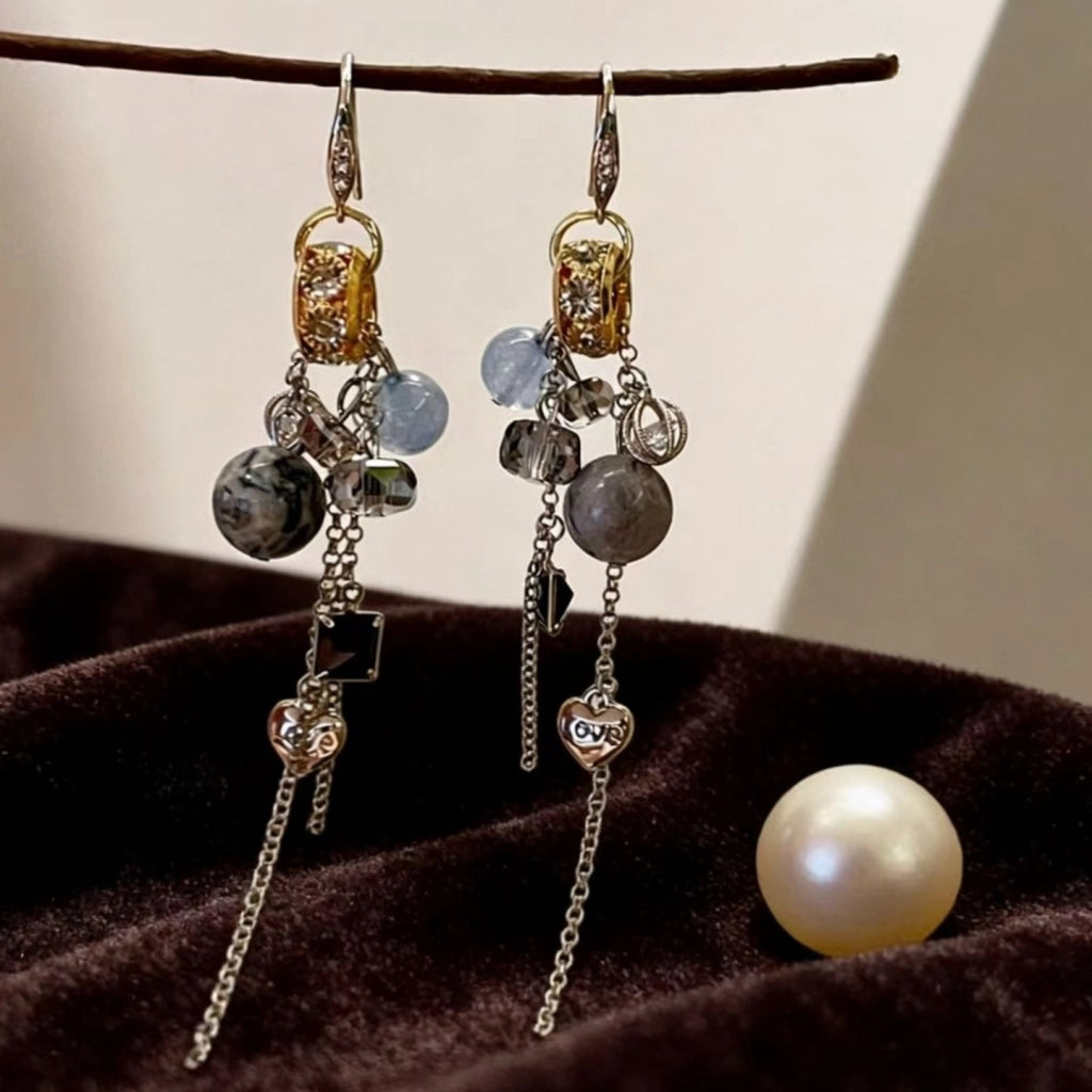 Orecchini vintage con sfera di cristallo blu e nappa