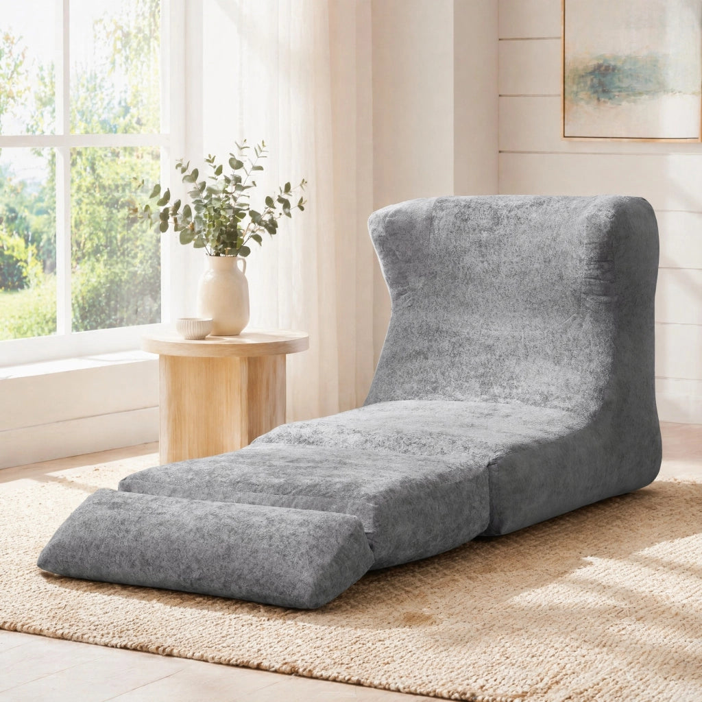 Poltrona componibile senza struttura in foam grigio, design moderno e uso versatile per soggiorno e camera da letto