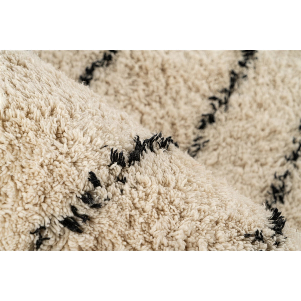 Tappeto Mylen in cotone crema e nero con frange