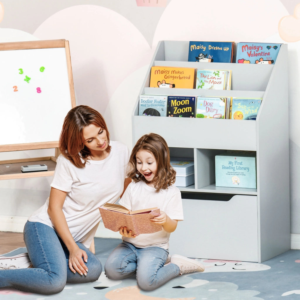 Libreria mobile per bambini con 3 ripiani 2 scomparti cassetto e 4 ruote ¨C Xylo ¨C Legno grigio 60x29,9x90 cm