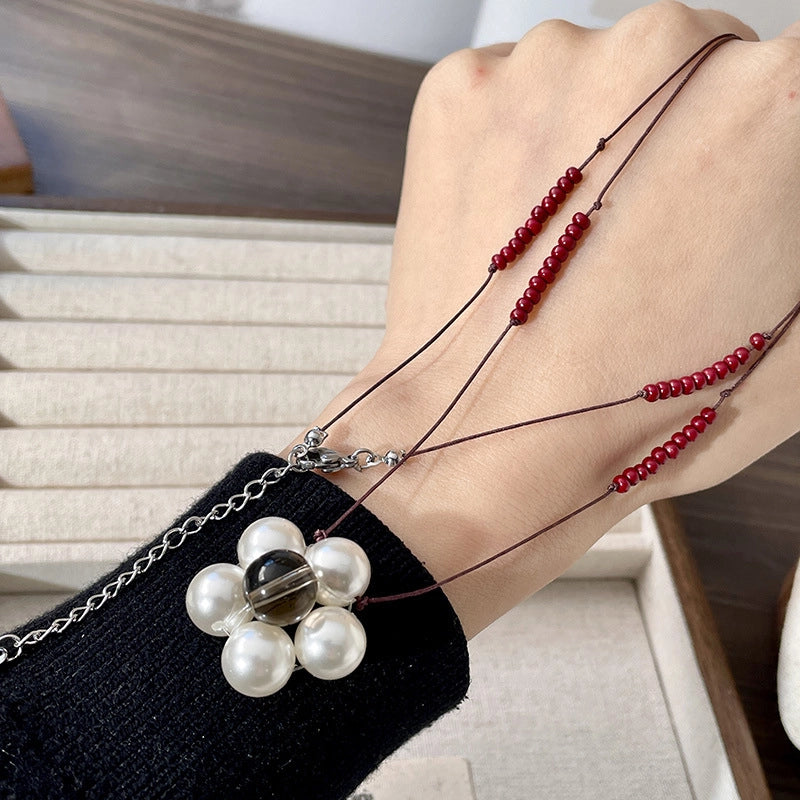 Collana intrecciata con corda di cera e fiori di perle, girocollo tridimensionale a pi¨´ strati con fiori.