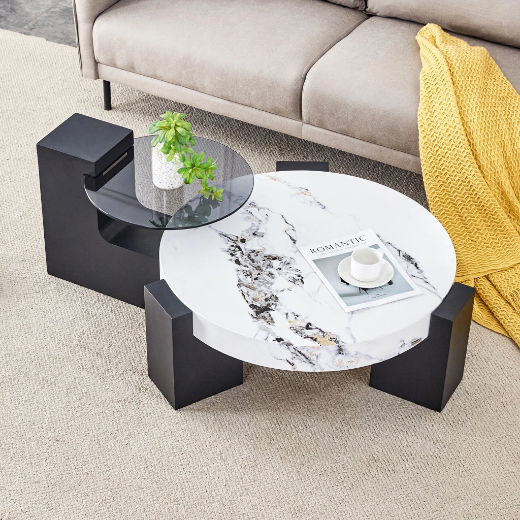 Tavolino rotondo moderno e semplice a due livelli: piano in vetro grigio trasparente e base in MDF nero a forma di L. Piano con effetto marmo bianco.