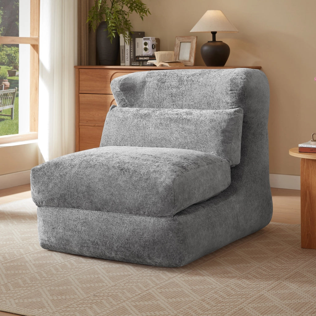 Poltrona componibile senza struttura in foam grigio, design moderno e uso versatile per soggiorno e camera da letto