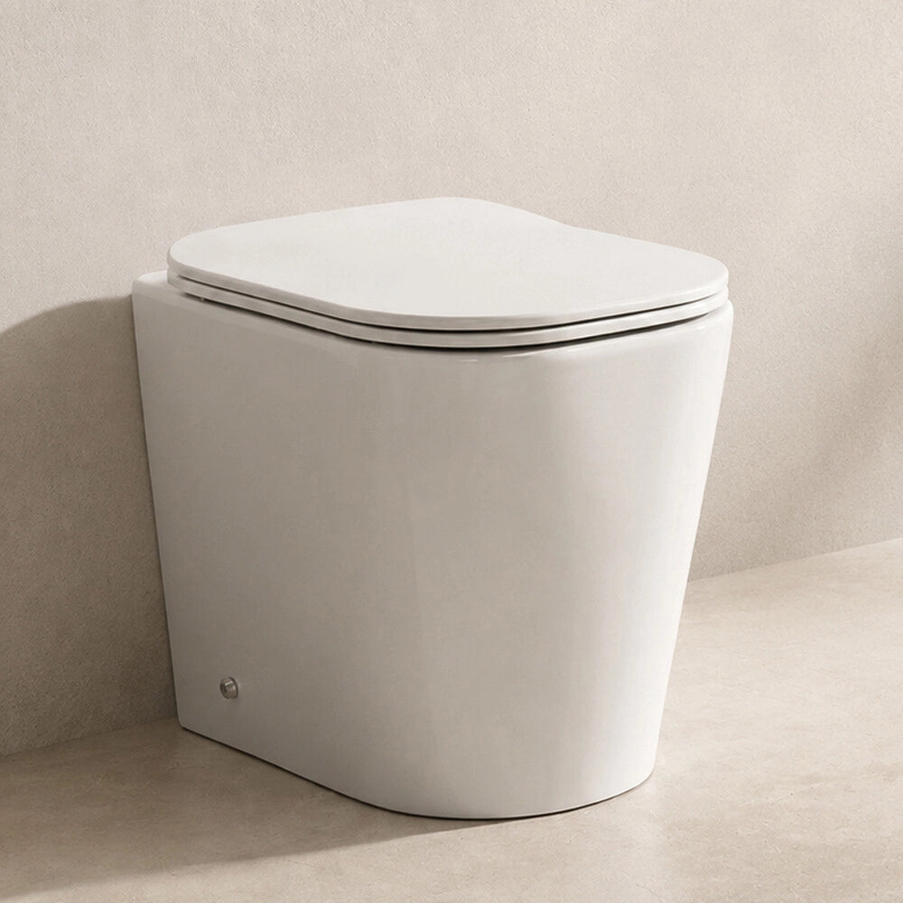 Wc filo muro profondità 48cm con scarico a terra tornado e sedile soft close Atami