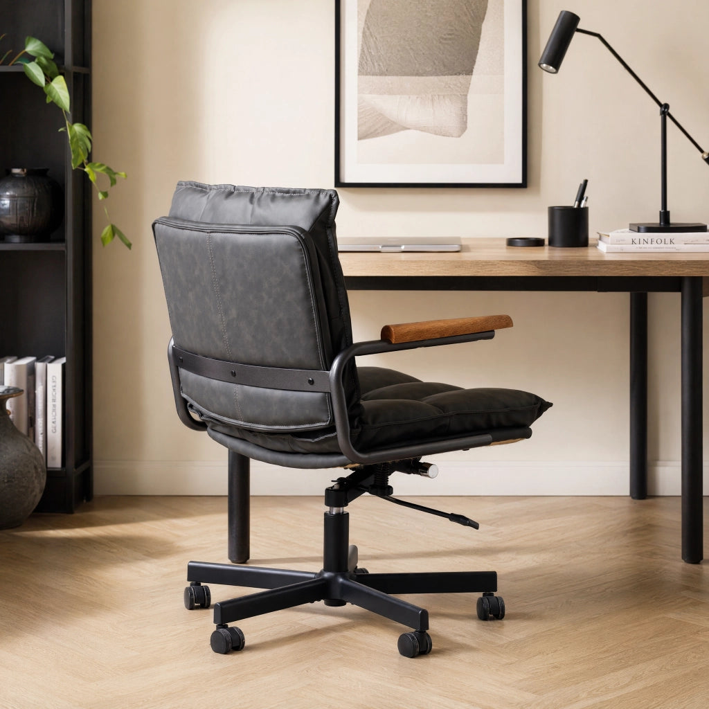 Sedia da ufficio ergonomica girevole 360° regolabile in pelle sintetica e metallo, Nero